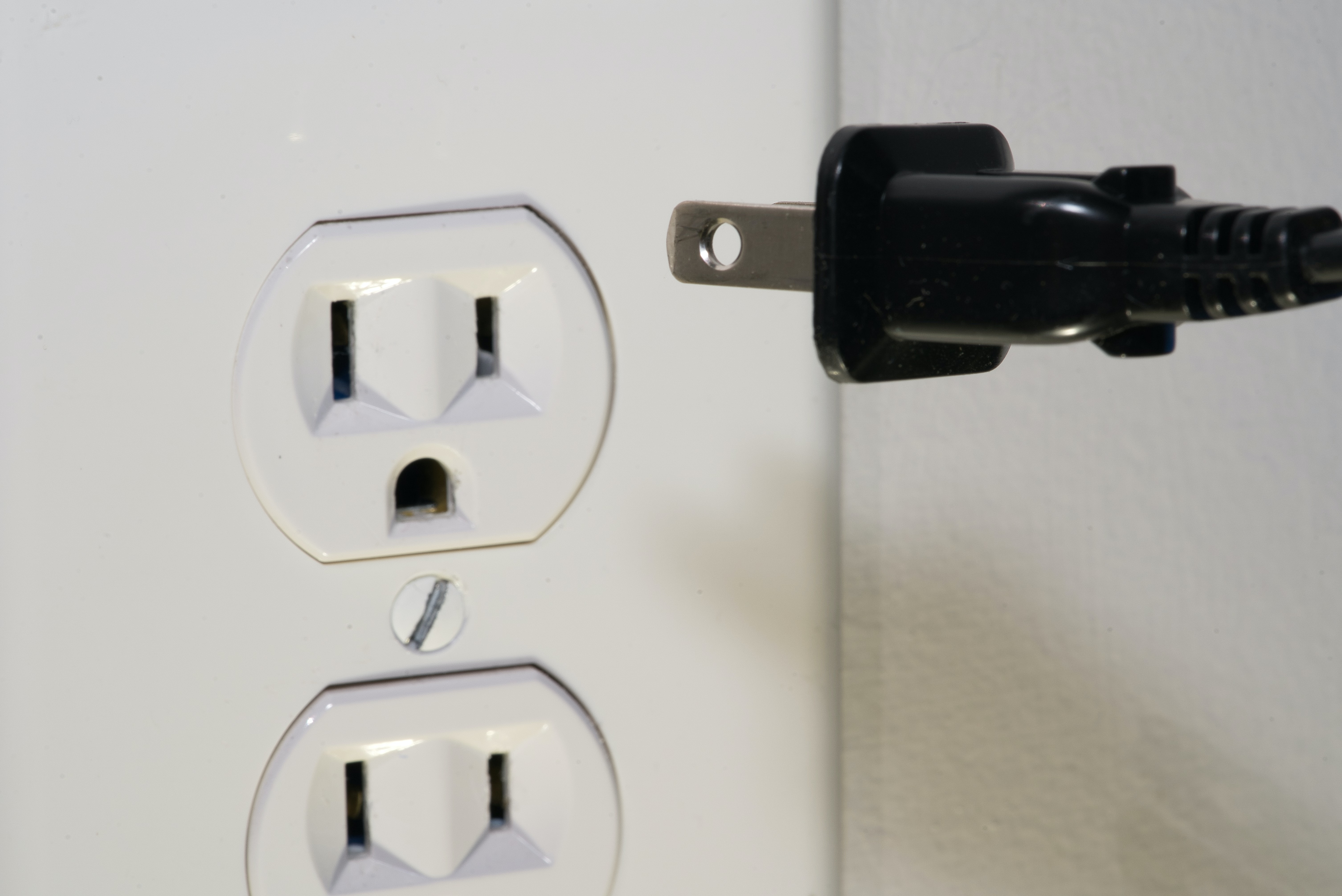 Plug going into an outlet