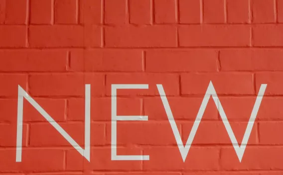 New sign on red wall